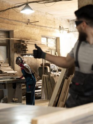 carpenter-cutting-mdf-board-inside-workshop